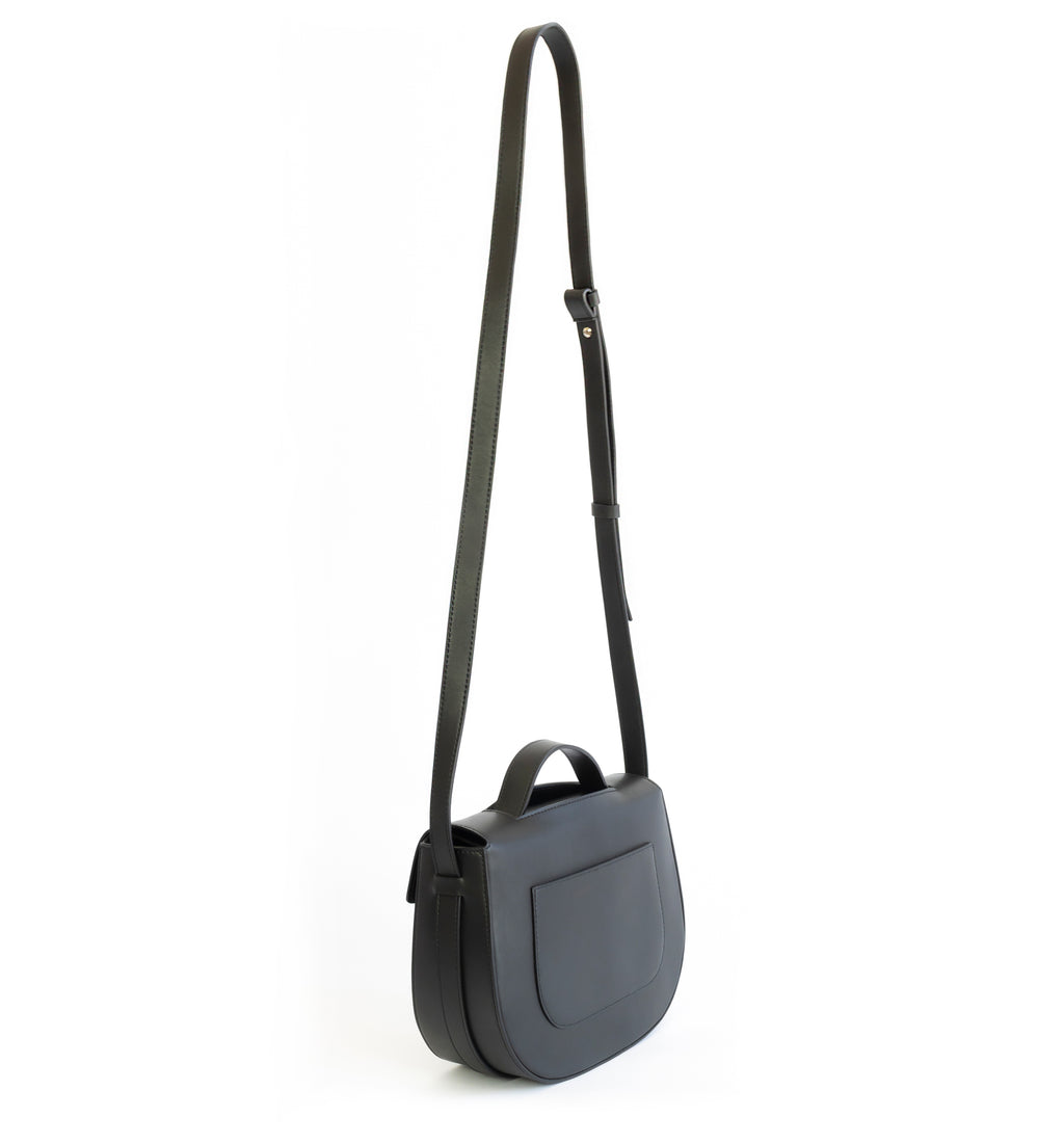 Eco vegan leather crossbody bag by Sydney Brown. Timeless, classic and modern. Shoulder or crossbody strap view.