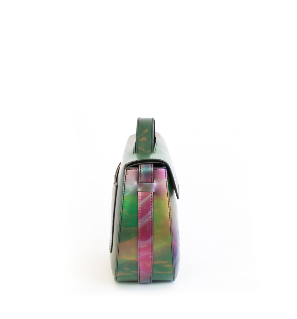 Printed iridescent vegan leather crossbody bag by Sydney Brown. Timeless, classic and modern.  Side view.