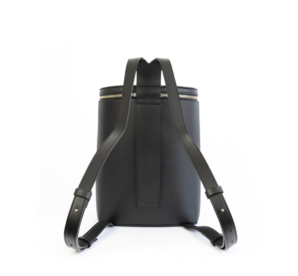 Black eco vegan leather bucket backpack by Sydney Brown. Timeless, classic and modern.  Back view
