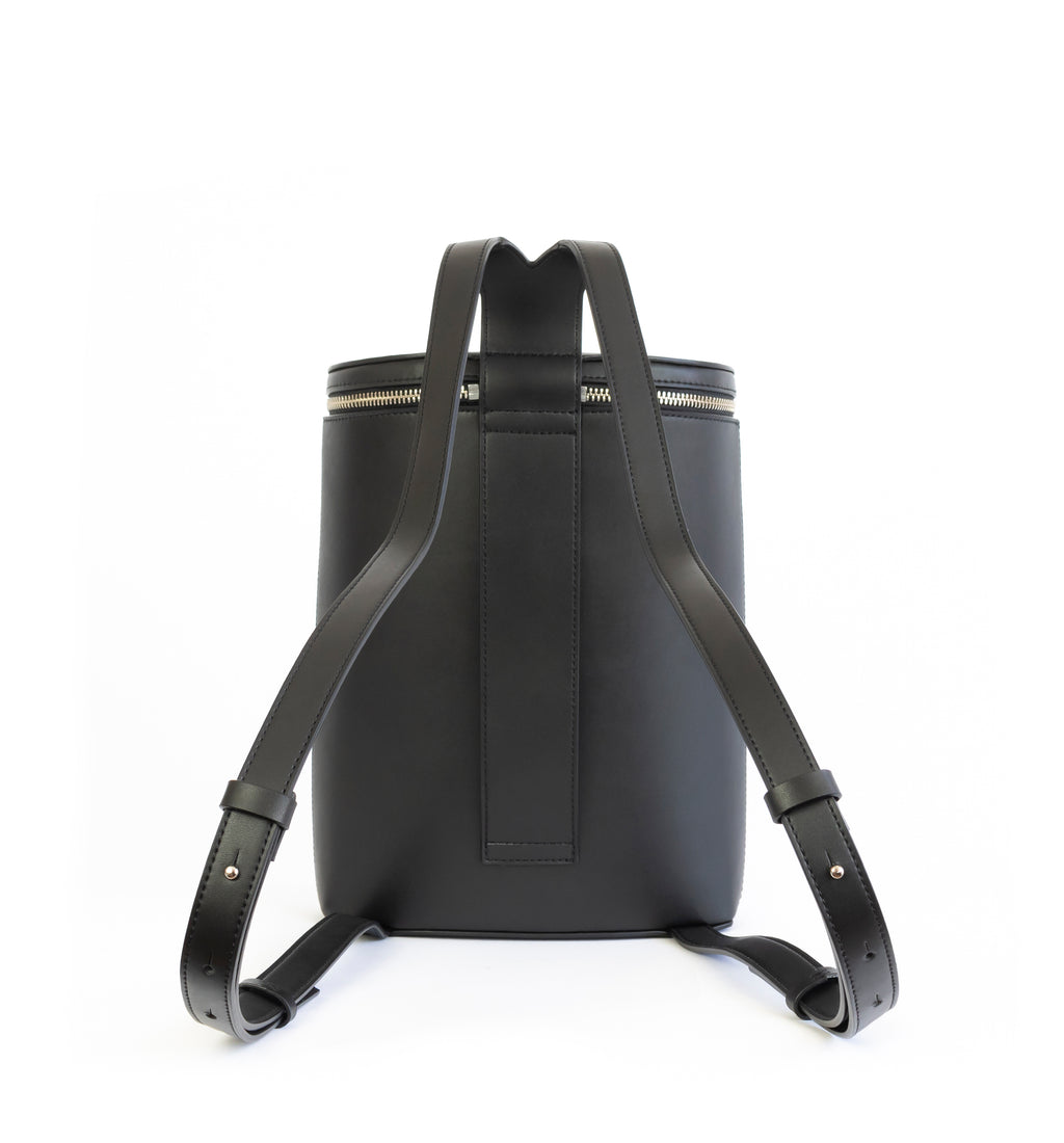 Black eco vegan leather bucket backpack by Sydney Brown. Timeless, classic and modern.  Back view