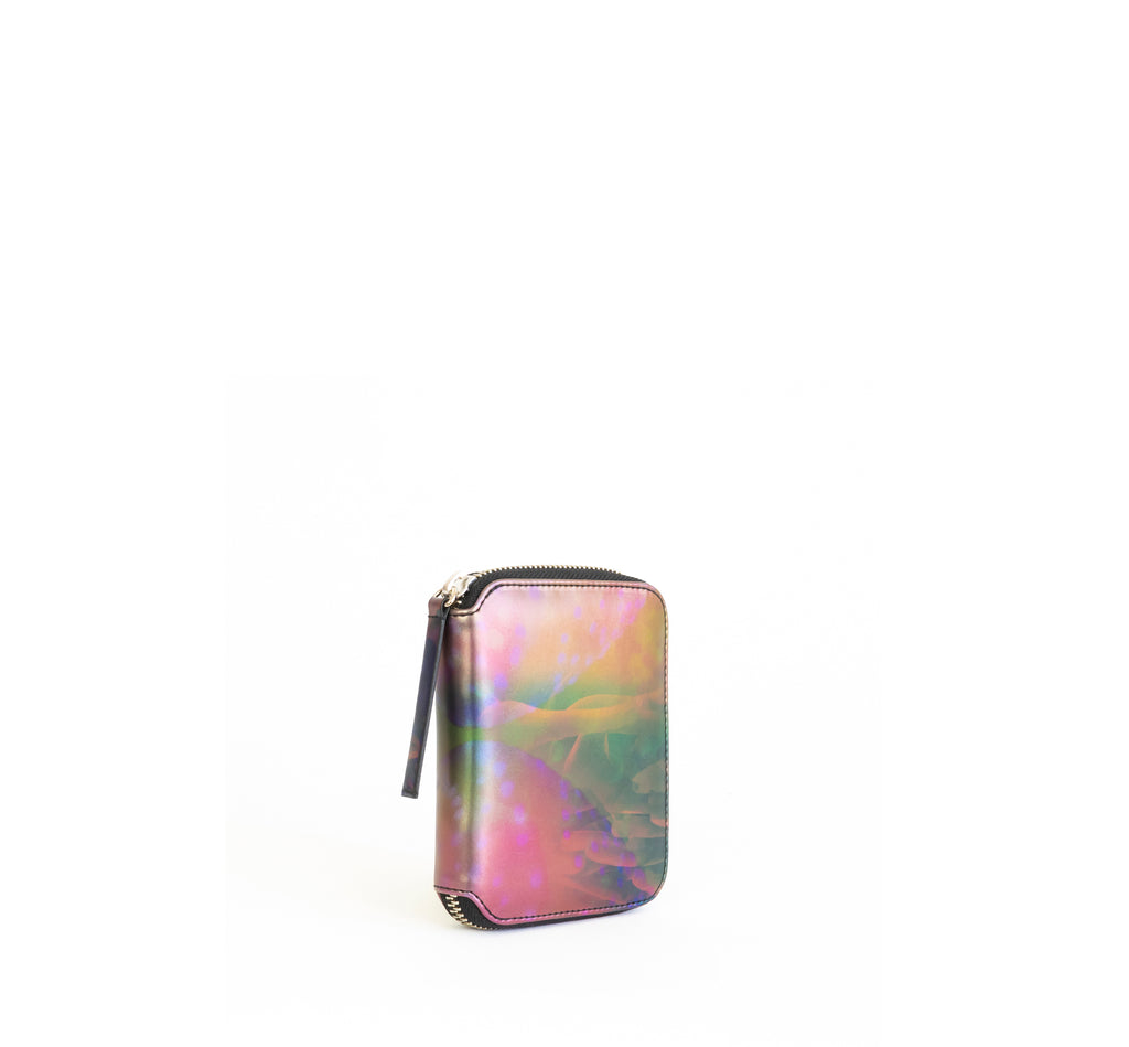 Unisex zipped wallet with inside coin pouch and card slots. Iridescent Print faux-leather. Front Angle