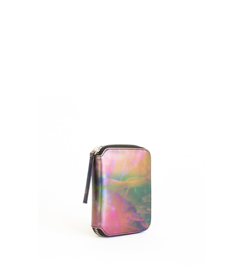 Unisex zipped wallet with inside coin pouch and card slots. Iridescent Print faux-leather. Front Angle