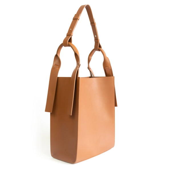 Brown eco vegan leather tote shoulder bag by Sydney Brown. Timeless, classic and modern. Angle view.