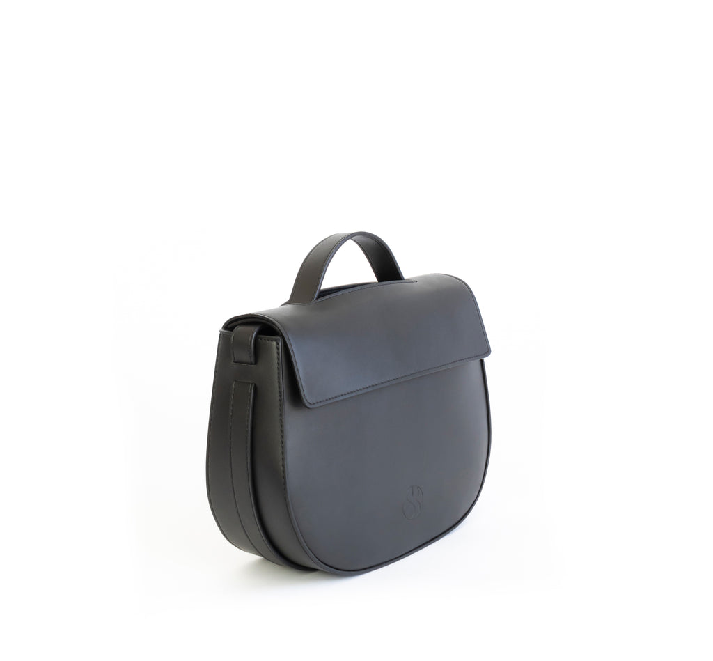 Eco vegan leather crossbody bag by Sydney Brown. Timeless, classic and modern. Angle view