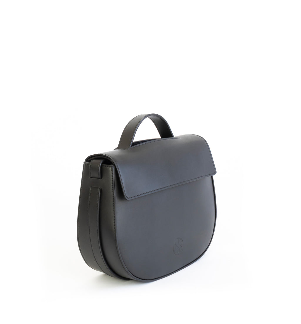 Eco vegan leather crossbody bag by Sydney Brown. Timeless, classic and modern. Angle view