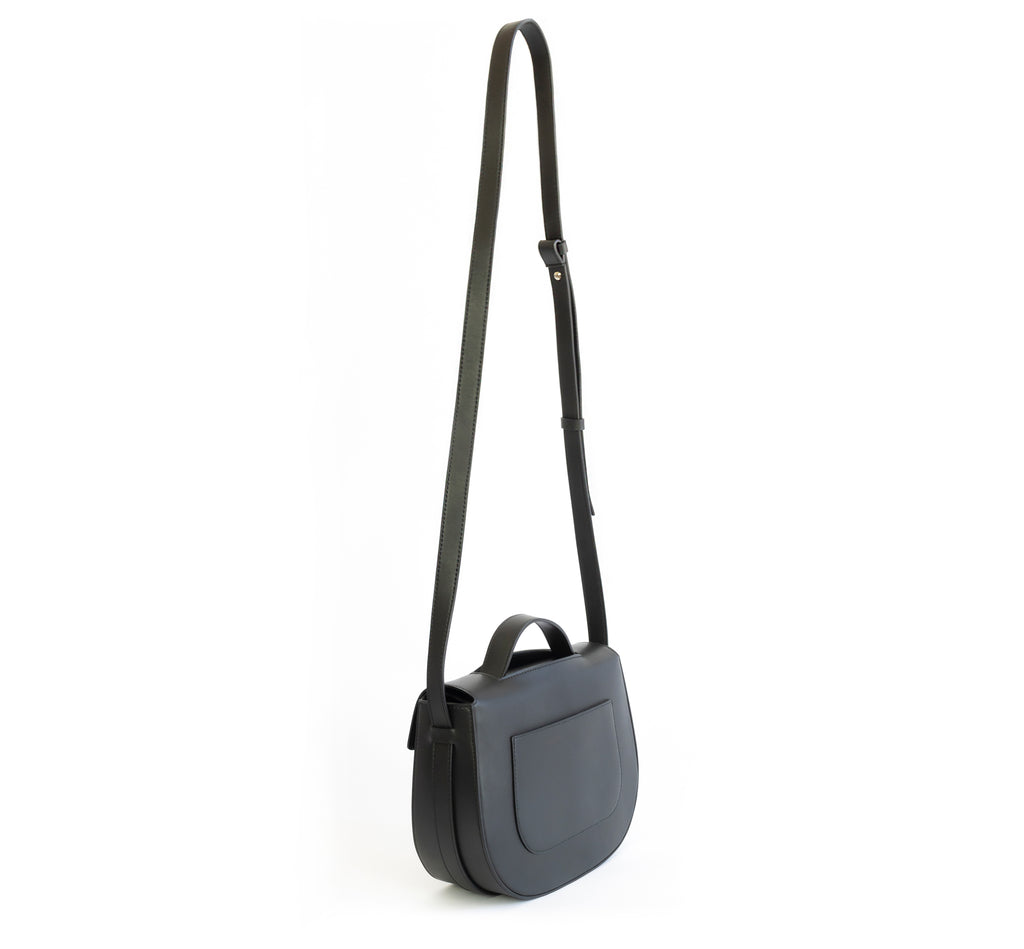 Eco vegan leather crossbody bag by Sydney Brown. Timeless, classic and modern. Shoulder or crossbody strap view.