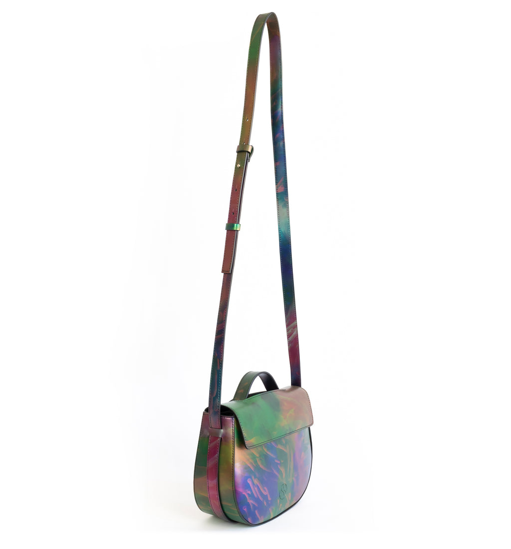 Printed iridescent vegan leather crossbody bag by Sydney Brown. Timeless, classic and modern.  Angle front crossbody, shoulder strap.