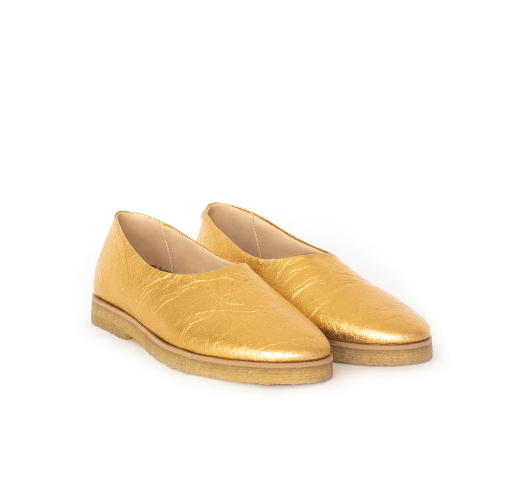 Almond toe flat in gold pinatex, pinneapple vegan leather alternative, natural rubber sole.