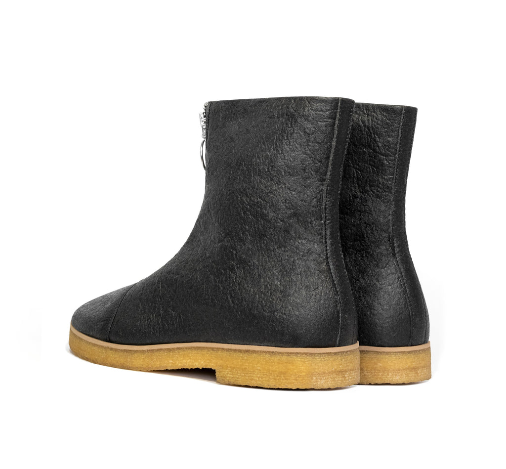 Boot in Black vegan pineapple leather alternative, pinatex, frontal zip, almond toe, natural rubber crepe sole.