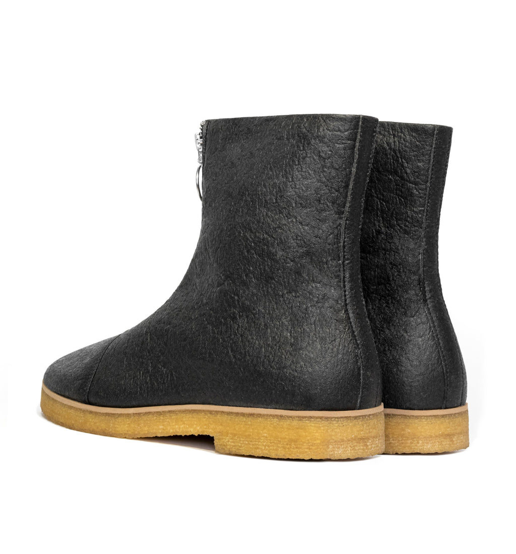 Boot in Black vegan pineapple leather alternative, pinatex, frontal zip, almond toe, natural rubber crepe sole.