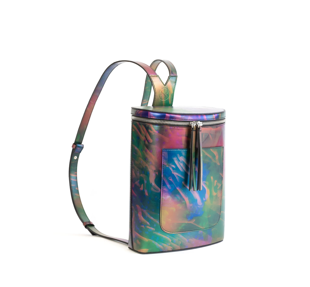 Printed iridescent vegan leather bucket backpack by Sydney Brown. Timeless, classic and modern.  Angle