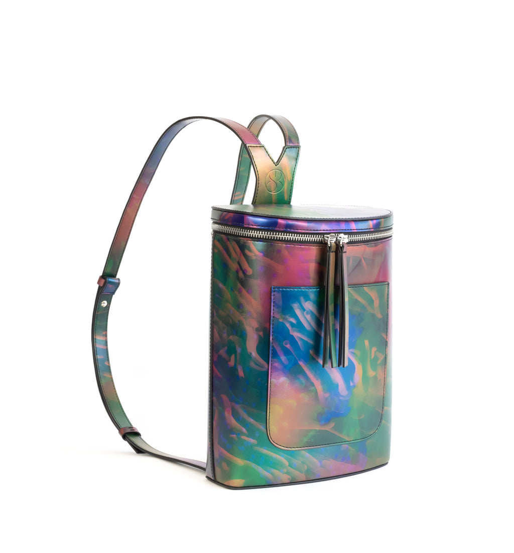 Printed iridescent vegan leather bucket backpack by Sydney Brown. Timeless, classic and modern.  Angle