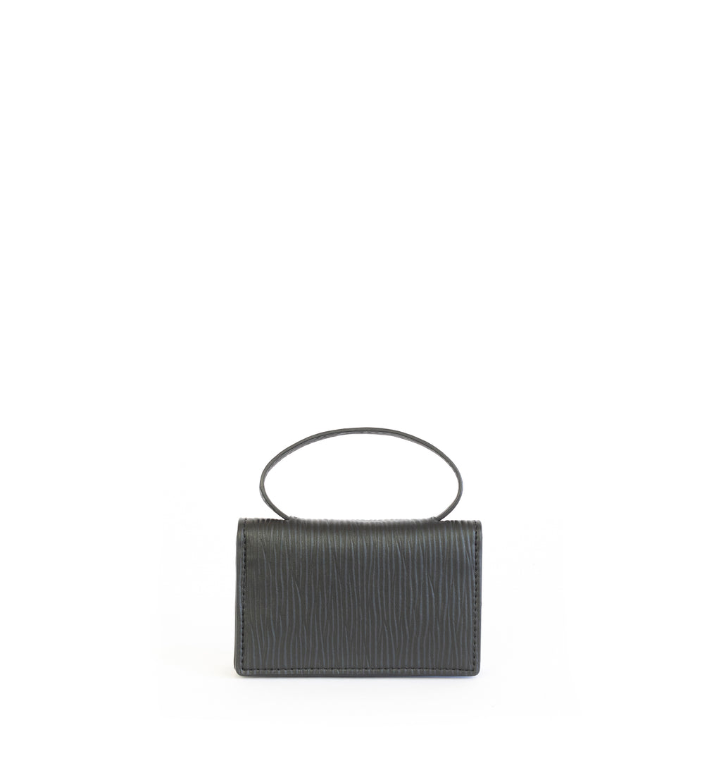 Microbag wallet with handle and an interior and exterior card slot. Black emboss faux-leather. Front