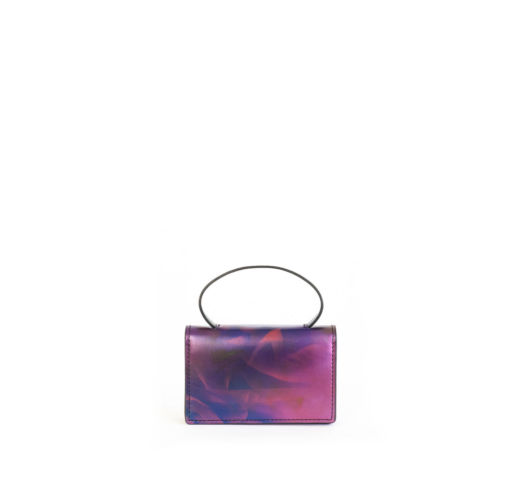 Microbag wallet with handle and an interior and exterior card slot. Iridescent Print faux-leather.