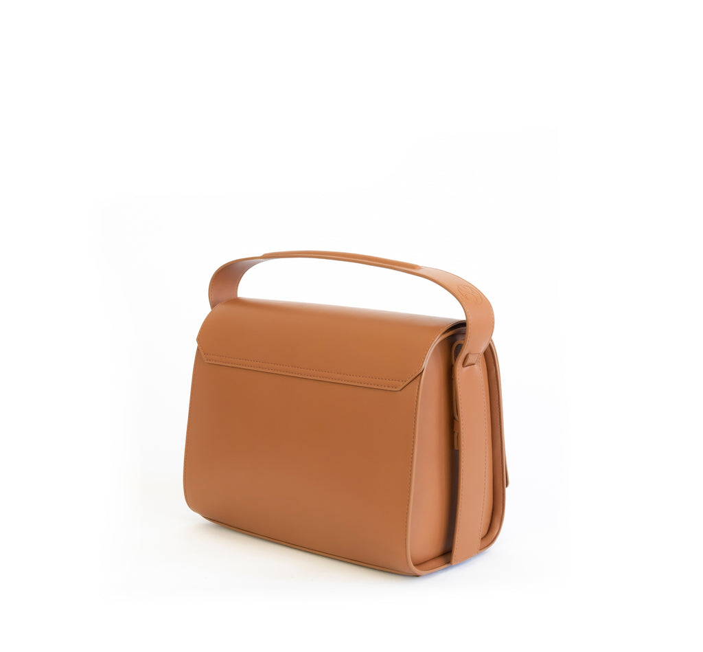 Brown eco vegan leather barrel shoulder bag by Sydney Brown. Timeless, classic and modern. Angle Back view