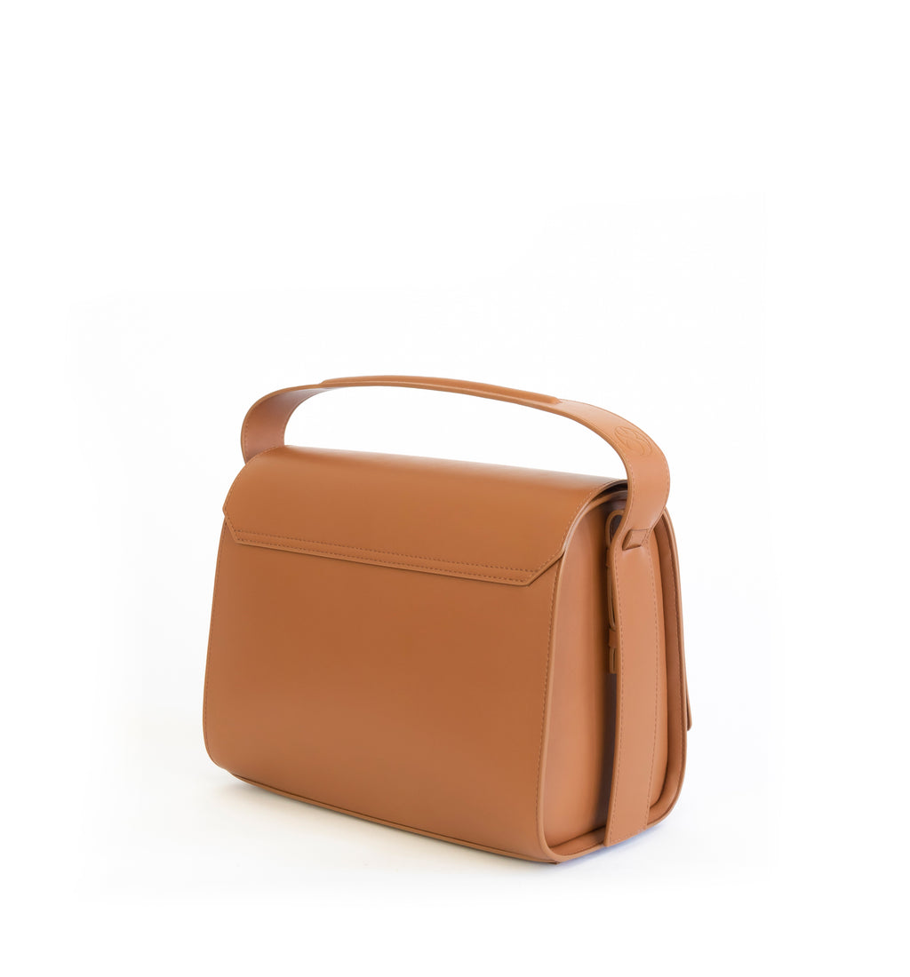 Brown eco vegan leather barrel shoulder bag by Sydney Brown. Timeless, classic and modern. Angle Back view