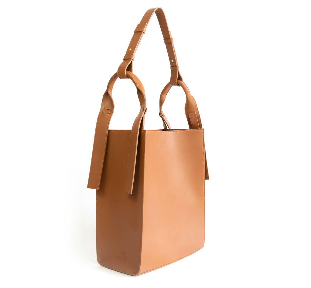 Brown eco vegan leather tote shoulder bag by Sydney Brown. Timeless, classic and modern. Angle view.