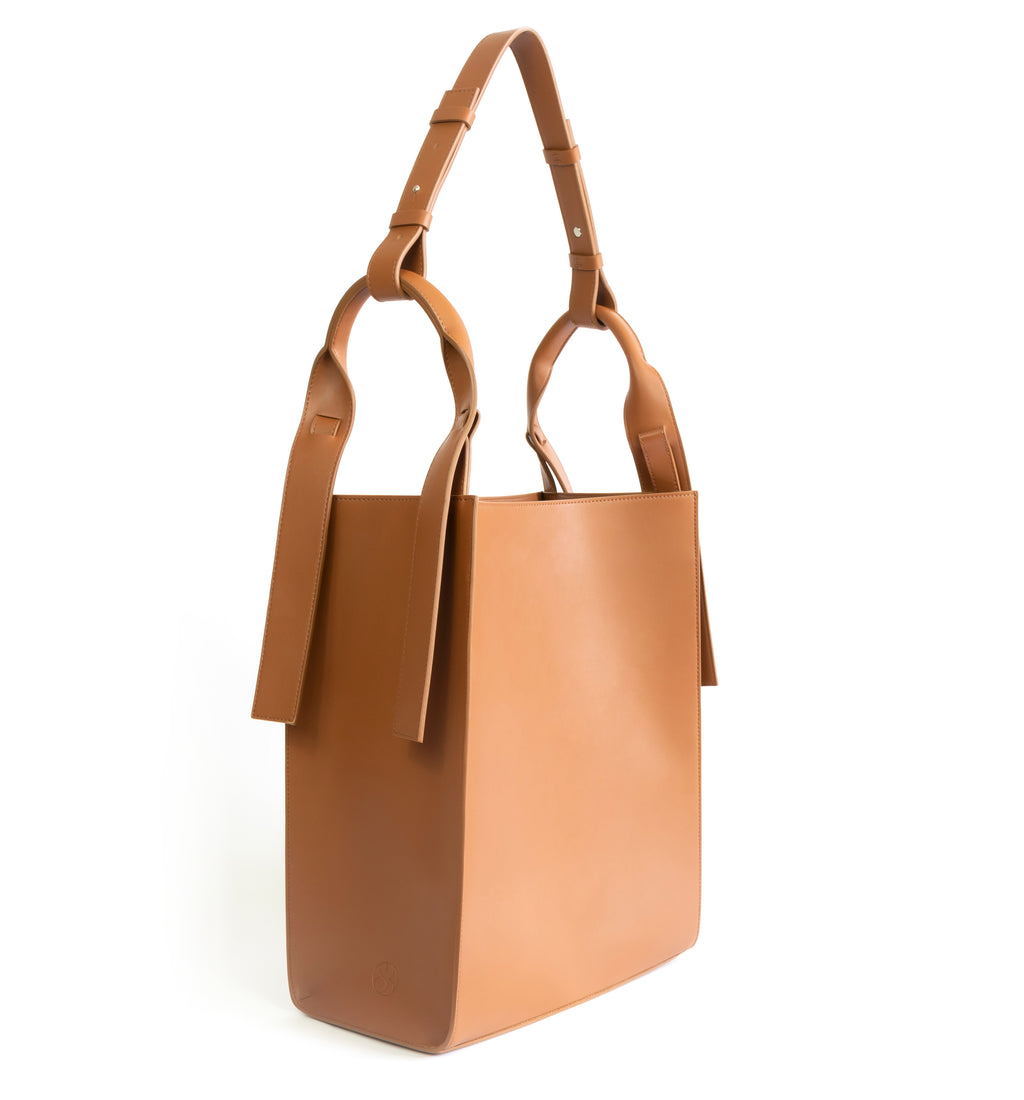 Brown eco vegan leather tote shoulder bag by Sydney Brown. Timeless, classic and modern. Angle view.
