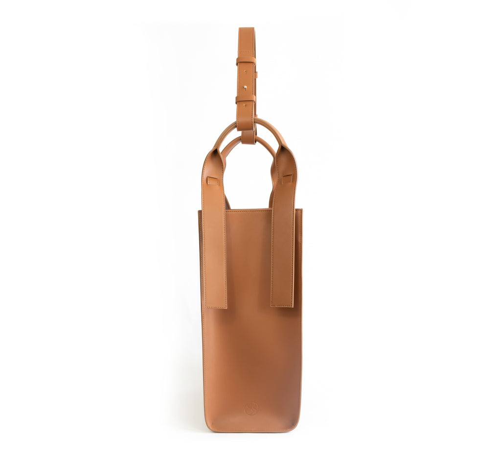 Brown eco vegan leather tote shoulder bag by Sydney Brown. Timeless, classic and modern. Side view.
