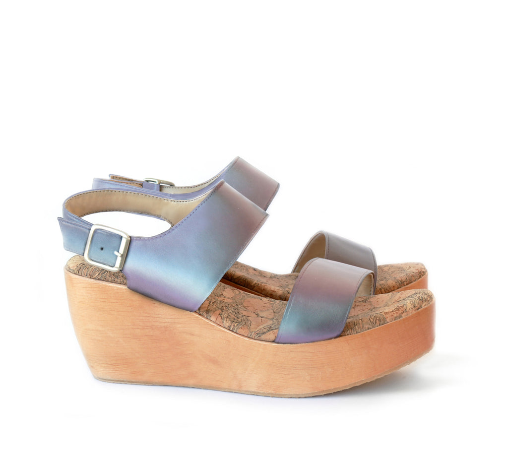Sandal with two straps, matte iridescent vegan leather with a natural wood platform.